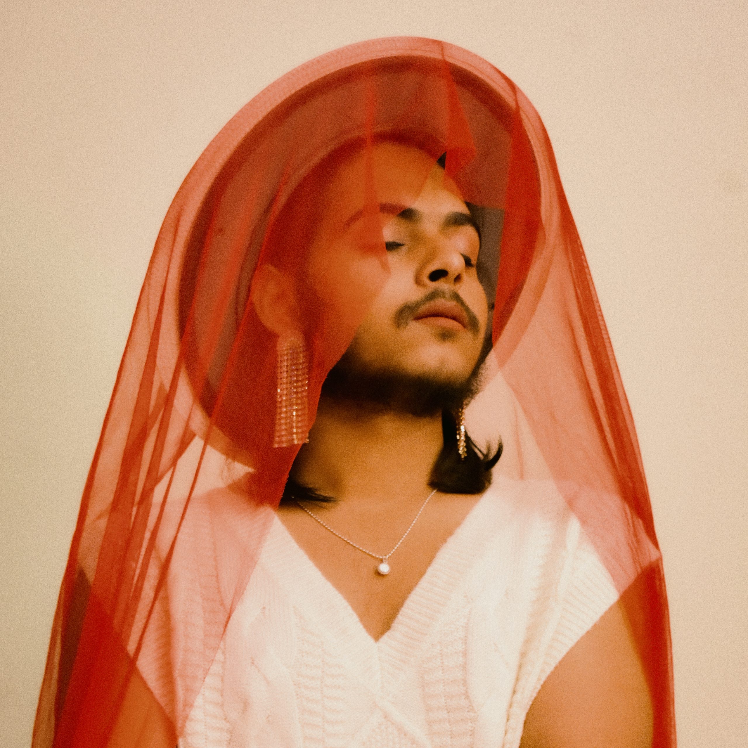 a-queer-man-with-a-red-veil-on-his-head-scopio-903-2026-03-17-00-05-19-utc